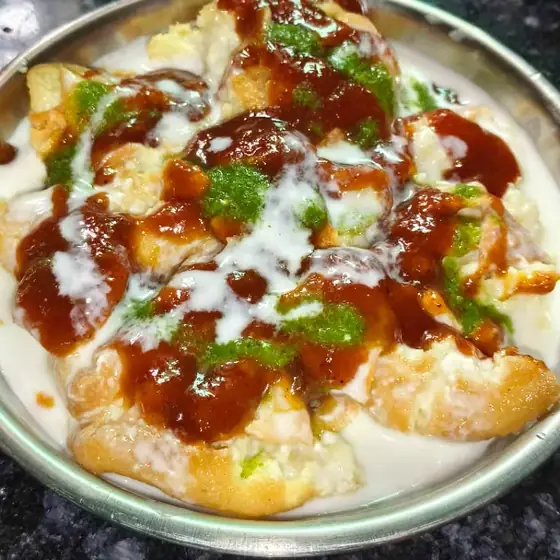 Dahi bhalle topped with chutney